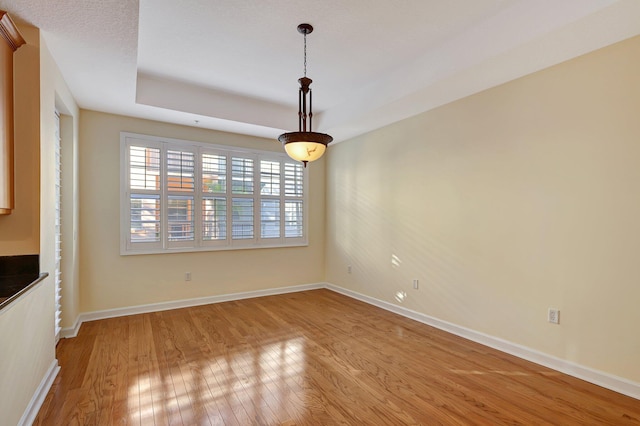 unfurnished dining area with wood-type flooring