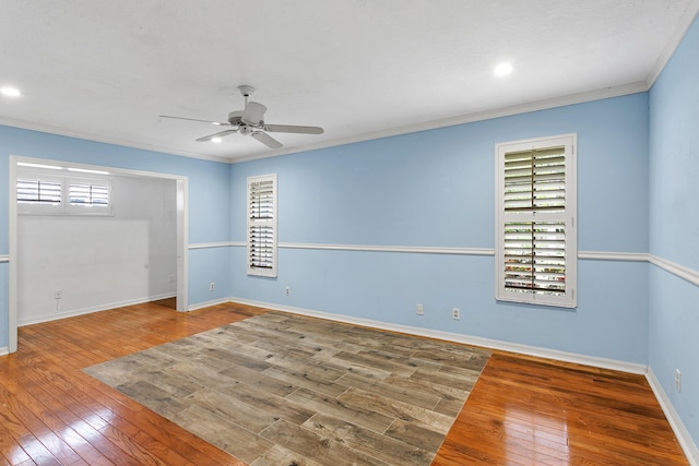 unfurnished room featuring wood-type flooring, ceiling fan, and crown molding