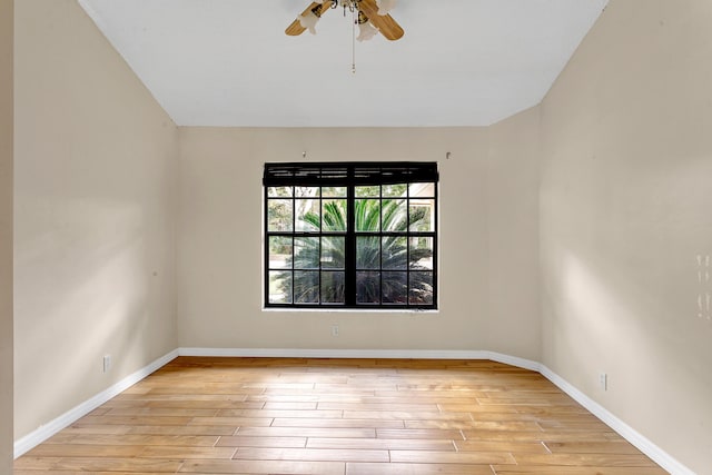 spare room featuring ceiling fan and light hardwood / wood-style flooring