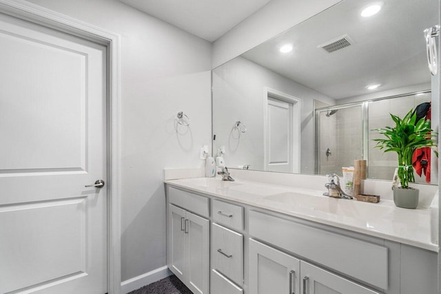 bathroom featuring vanity and walk in shower