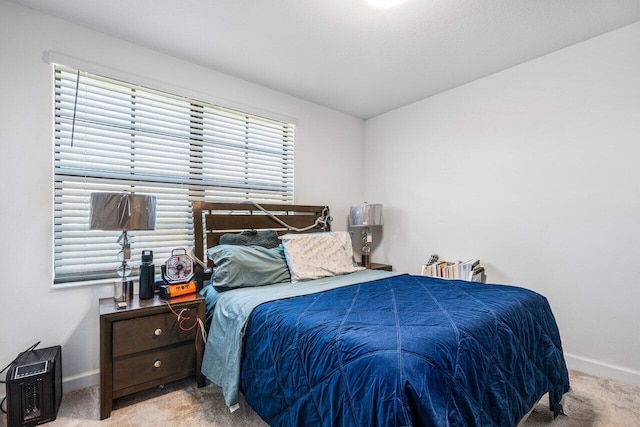 bedroom with light carpet