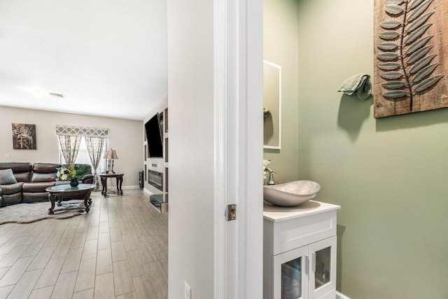 bathroom featuring vanity and hardwood / wood-style flooring