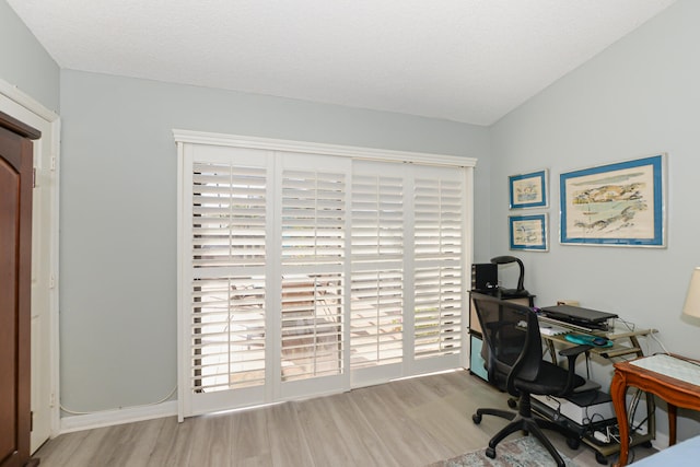 home office with wood finished floors