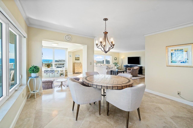 dining room with a chandelier and ornamental molding