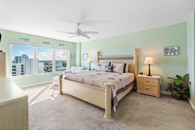 bedroom featuring ceiling fan and light colored carpet