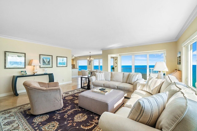 living room featuring a chandelier, a water view, plenty of natural light, and crown molding