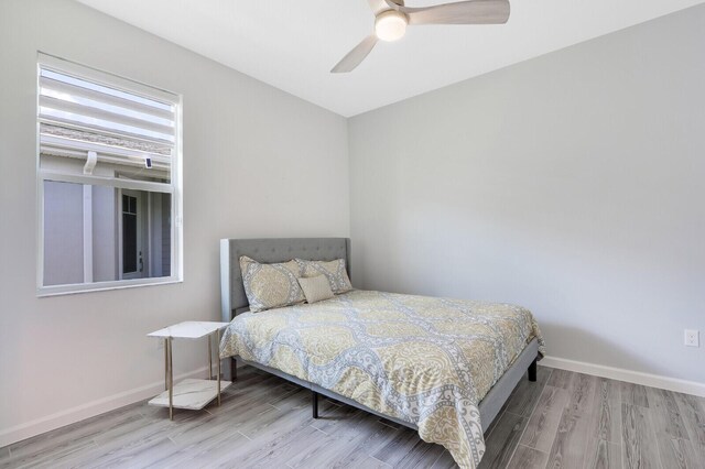 bedroom featuring hardwood / wood-style flooring and ceiling fan