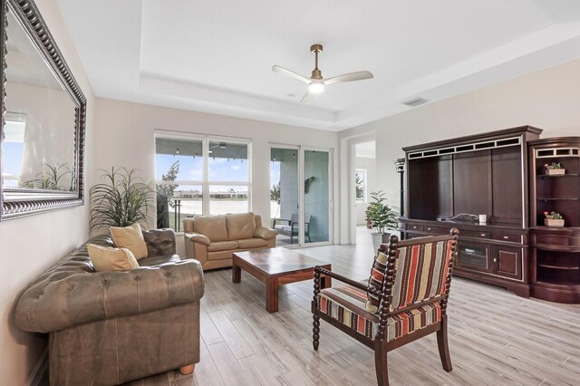 dining area with ceiling fan and light hardwood / wood-style flooring