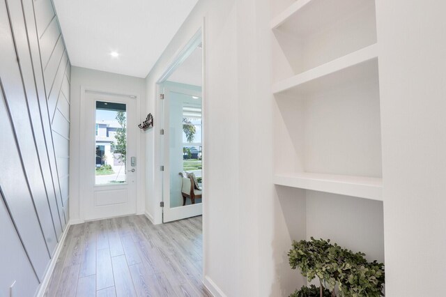 doorway to outside with light wood-type flooring