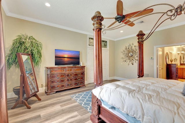 bedroom with light wood-type flooring, ensuite bathroom, ceiling fan, and ornamental molding