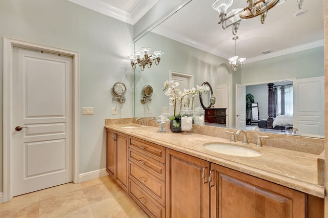 bathroom with tile patterned flooring, vanity, crown molding, and a notable chandelier