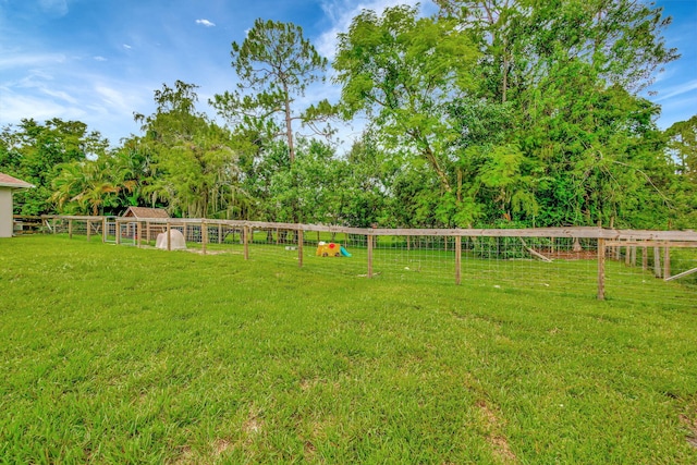 view of yard with a rural view