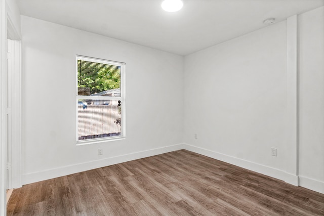 unfurnished room featuring wood-type flooring