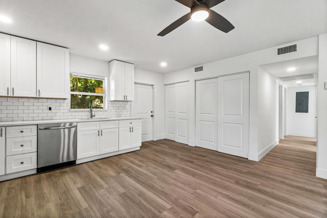 kitchen with white cabinetry, dishwasher, hardwood / wood-style flooring, and sink