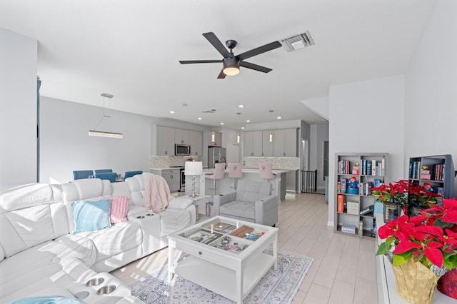 living room featuring ceiling fan