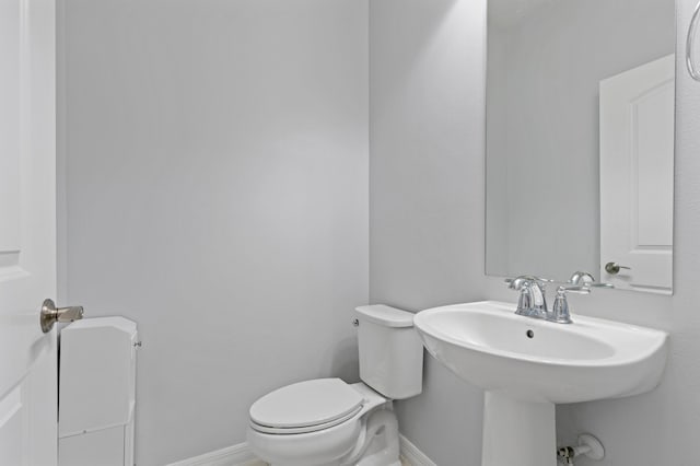 bathroom with toilet and sink