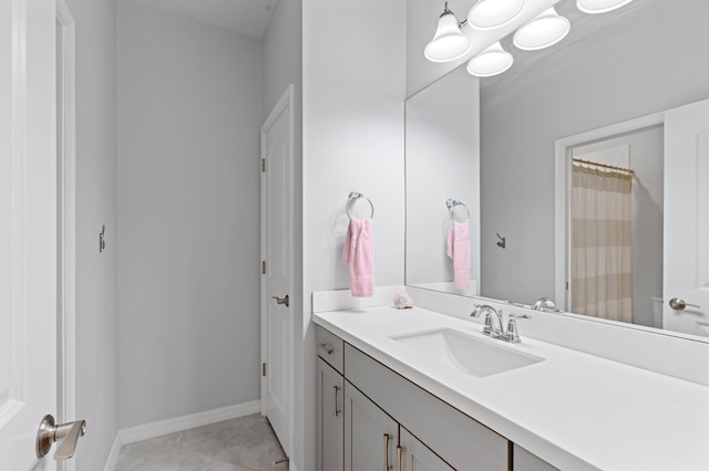 bathroom with tile patterned flooring and vanity