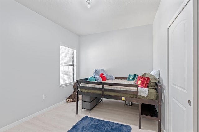 bedroom featuring light hardwood / wood-style floors