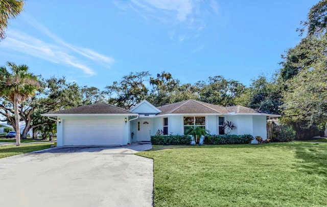 ranch-style home with a front yard and a garage