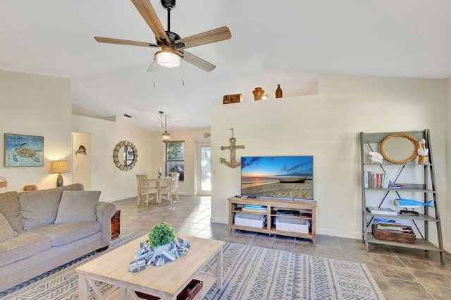 living room featuring vaulted ceiling and ceiling fan