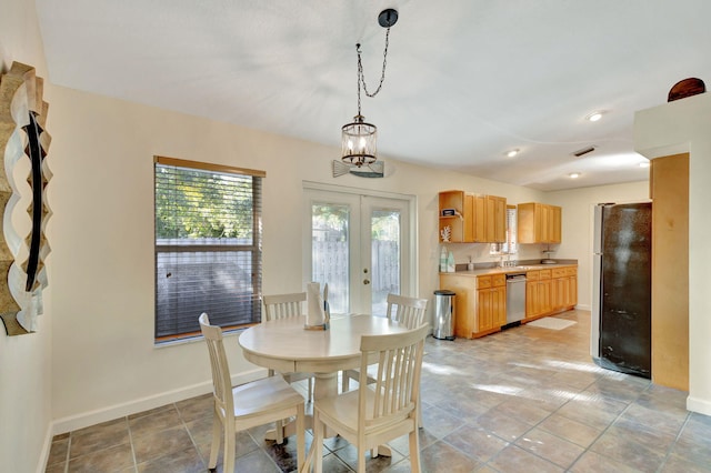 dining area with light tile patterned floors and french doors