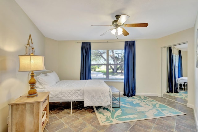 bedroom with ceiling fan and a closet