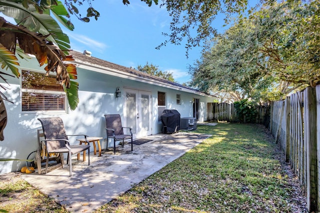 view of yard with a patio and central AC unit