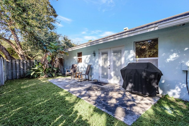 back of house featuring a yard