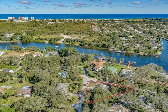 birds eye view of property with a water view