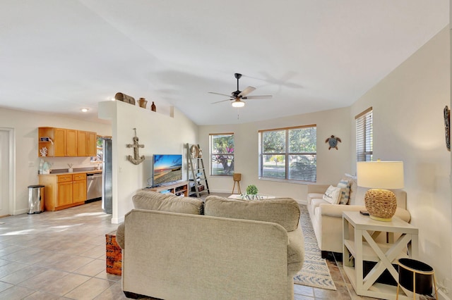 tiled living room with ceiling fan and lofted ceiling