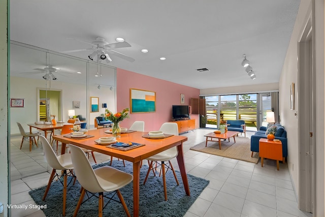 tiled dining room featuring ceiling fan