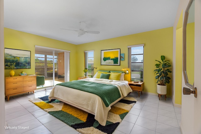 tiled bedroom featuring ceiling fan and access to outside