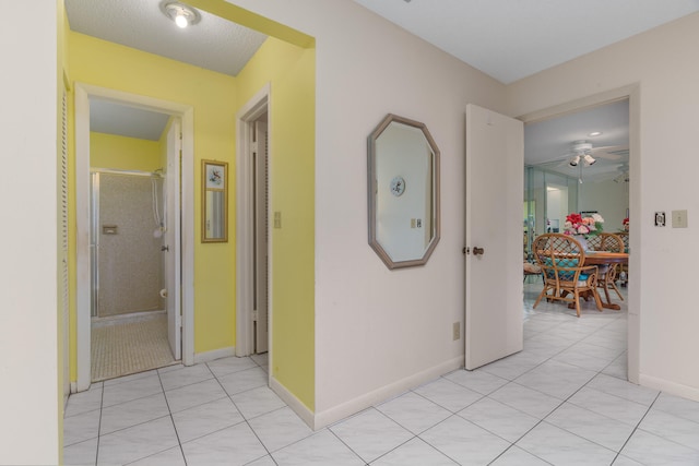 hallway with light tile patterned floors