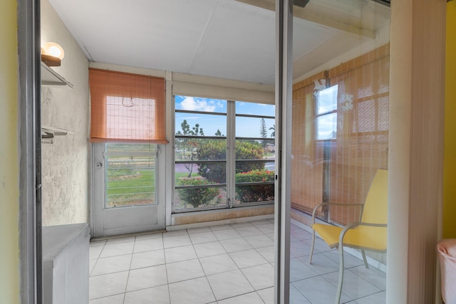 unfurnished sunroom featuring a wealth of natural light