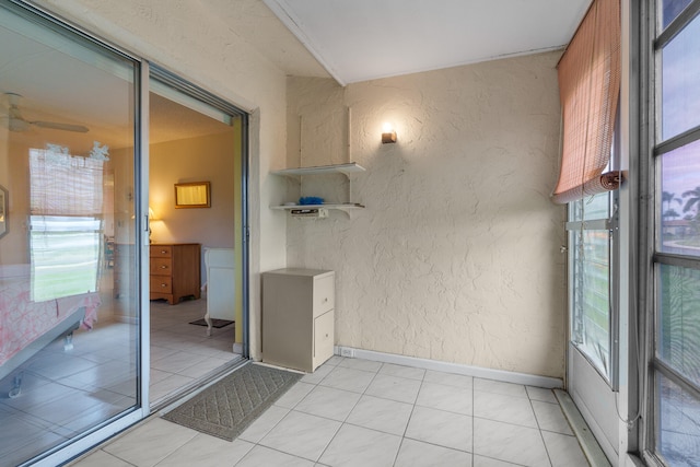 bathroom with plenty of natural light and tile patterned flooring