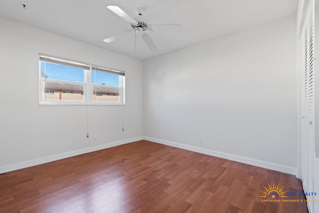 empty room featuring hardwood / wood-style floors, a textured ceiling, and ceiling fan