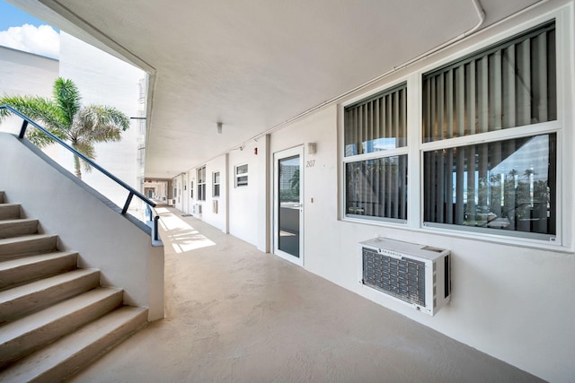 view of patio featuring a wall mounted air conditioner