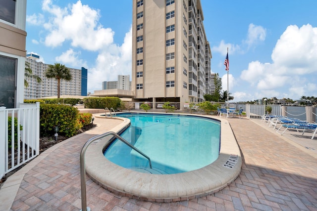 view of swimming pool with a patio area