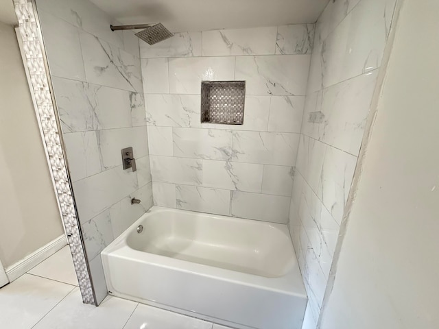 bathroom featuring tile patterned floors and tiled shower / bath combo