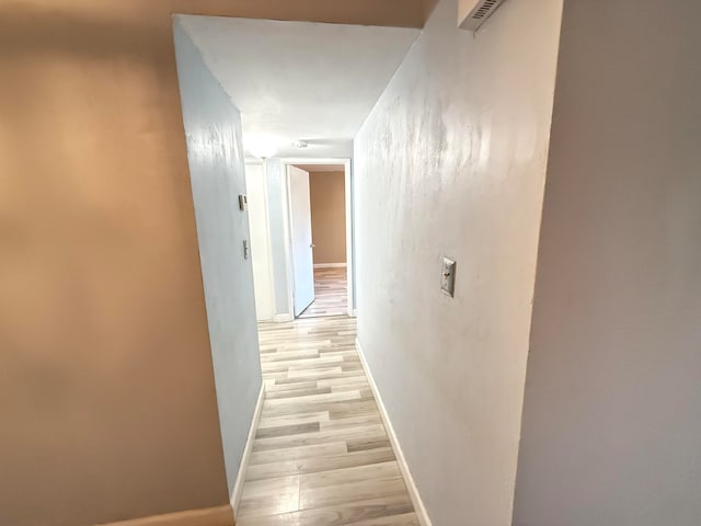 hallway featuring light hardwood / wood-style floors