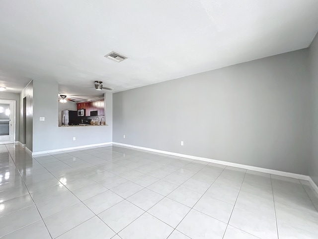 interior space featuring ceiling fan and light tile patterned floors