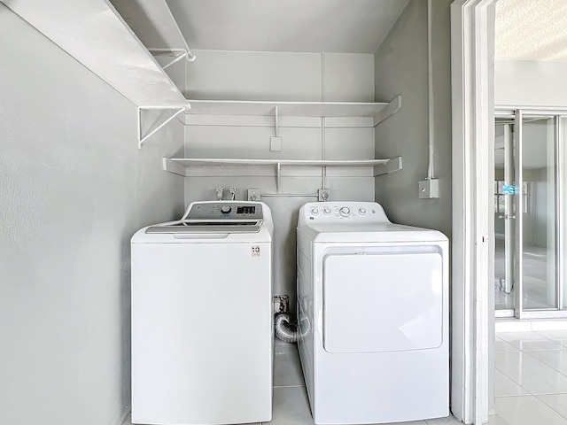 clothes washing area featuring washing machine and clothes dryer