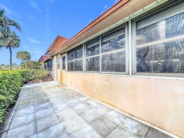 view of property exterior featuring a patio area