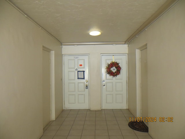 entryway featuring light tile patterned flooring