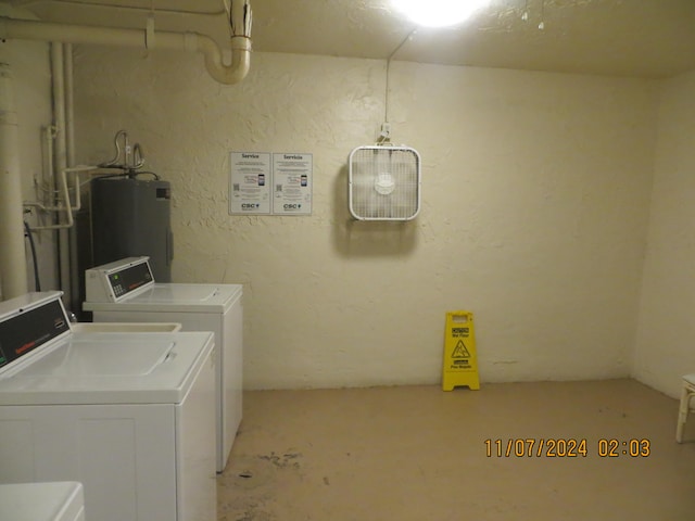 washroom featuring independent washer and dryer and water heater