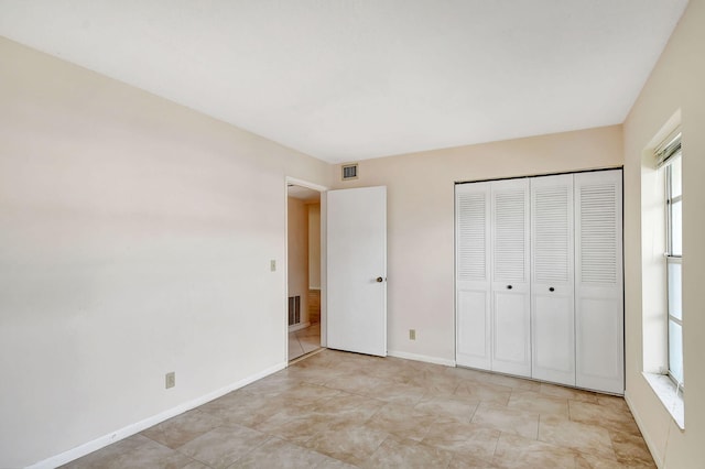 unfurnished bedroom with a closet