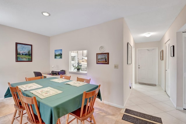 dining room featuring light tile patterned flooring