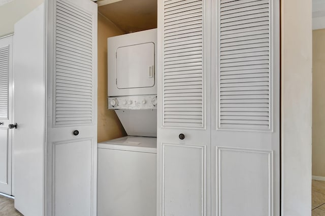 laundry area with stacked washer / drying machine