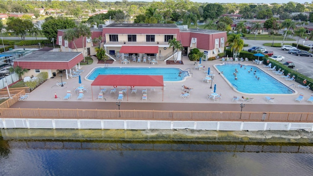 birds eye view of property with a water view