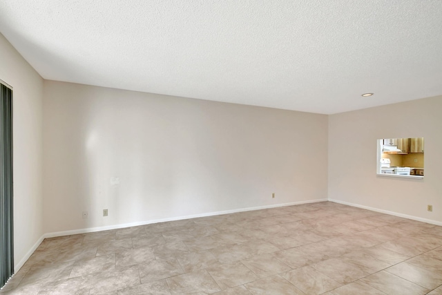 empty room with a textured ceiling